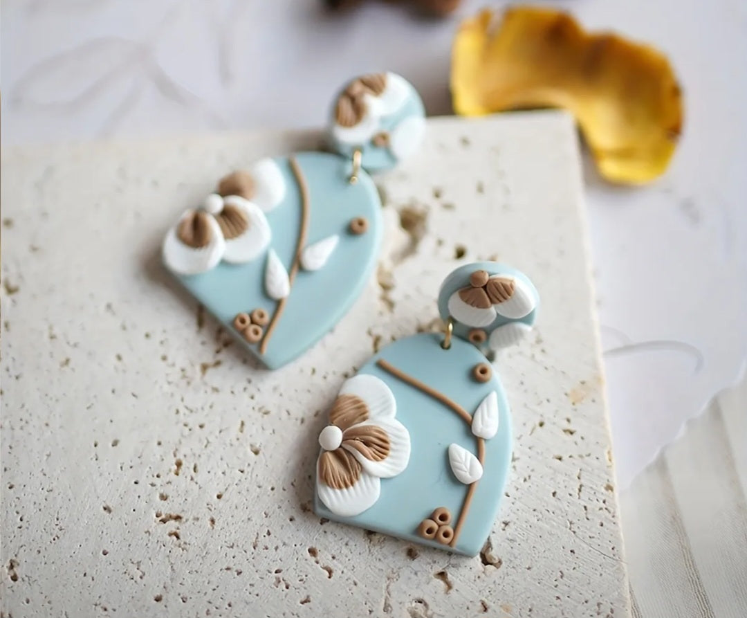 Light brown, white and blue earrings